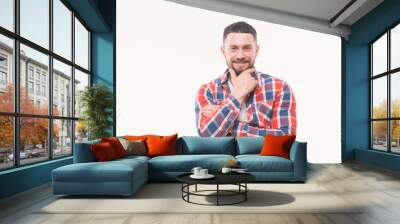 Handsome happy beard young man smiling and holding his chin, guy wearing red shirt, isolated on white background Wall mural